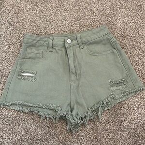green jean shorts